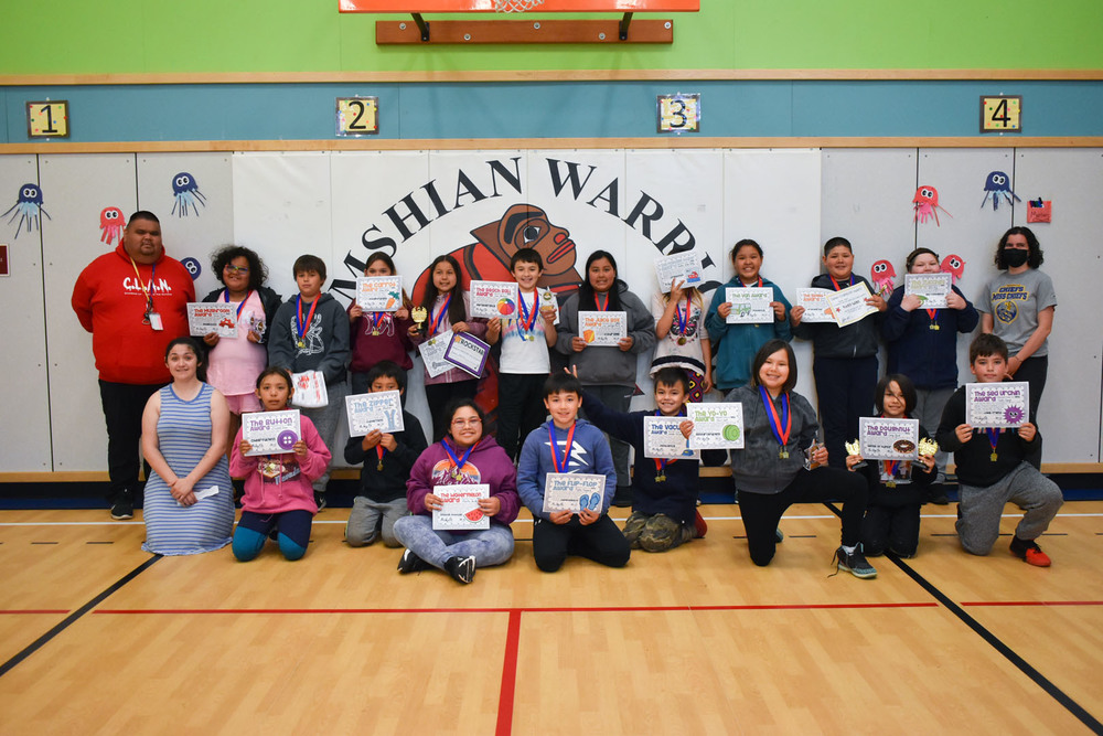 Picture of students holding up awards