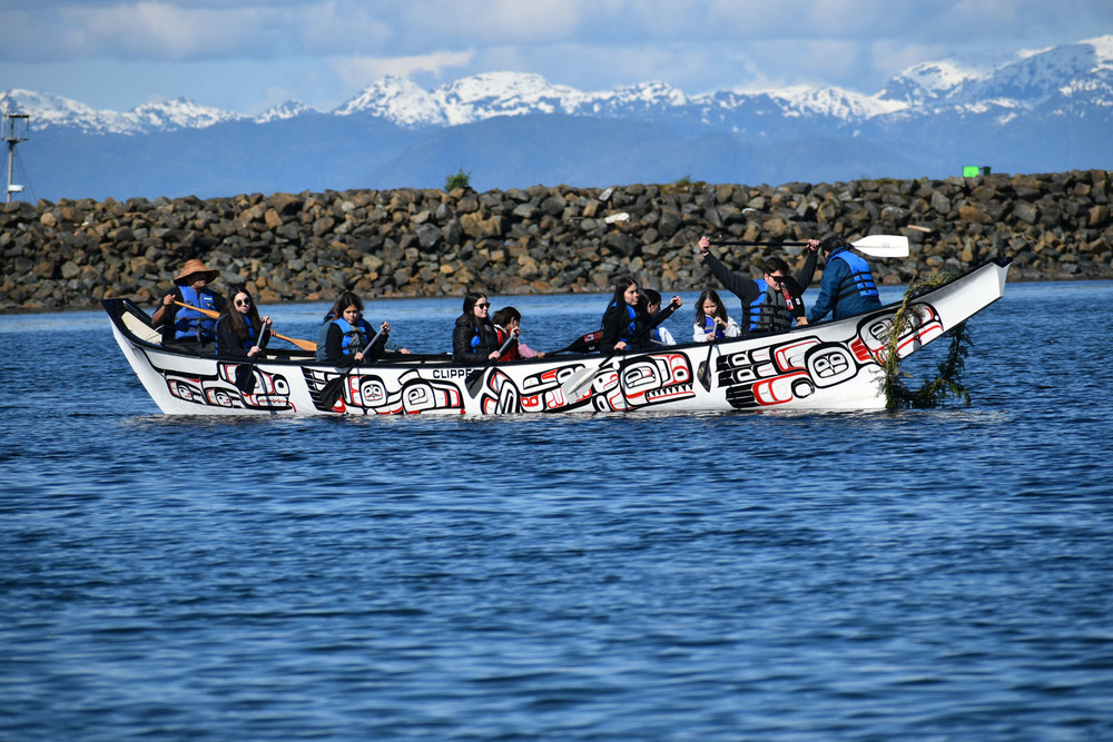 students in a large xsoo canoe