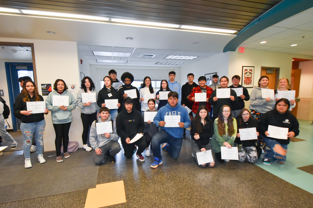 students posing with award certificates