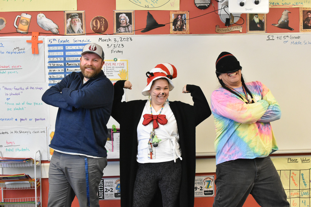 teachers posing for dr seuss week in hats