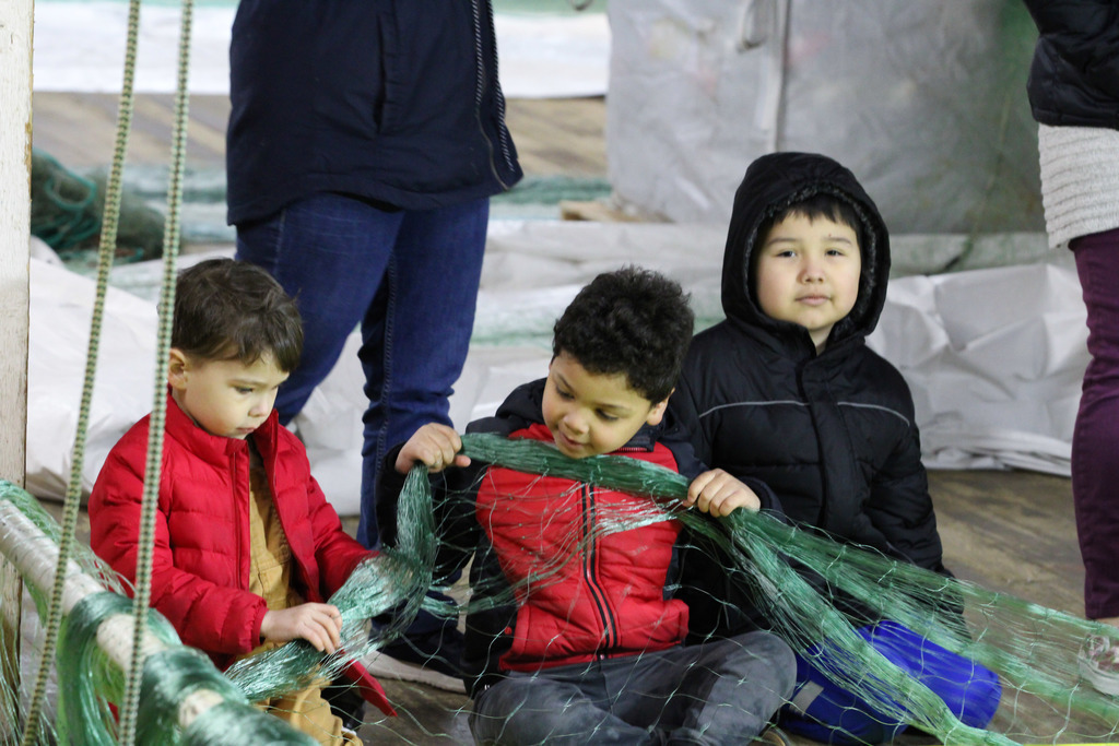 students holding a fishing net