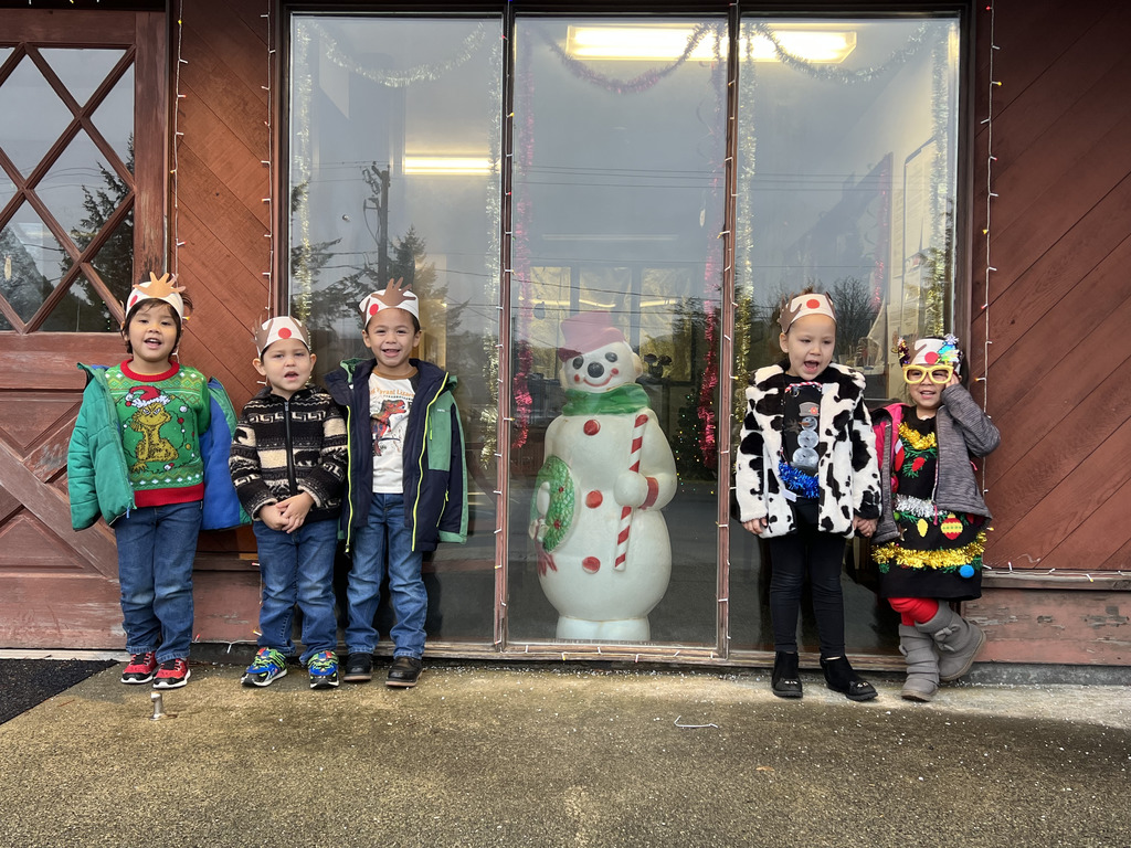students in front of windows in winter clothes