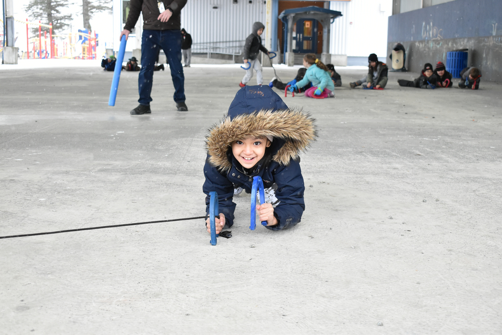 students crawling and laughing with ropes