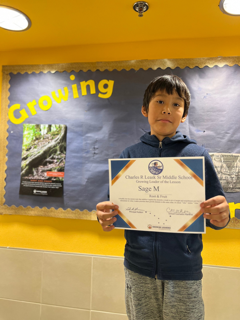 student holding certificate