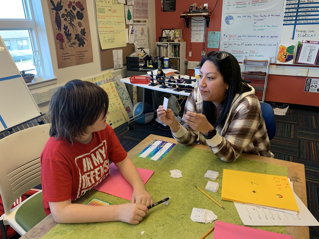 teacher and student working on flashcards