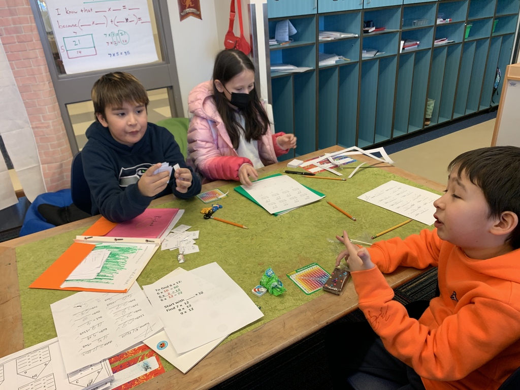 students working on math at a table