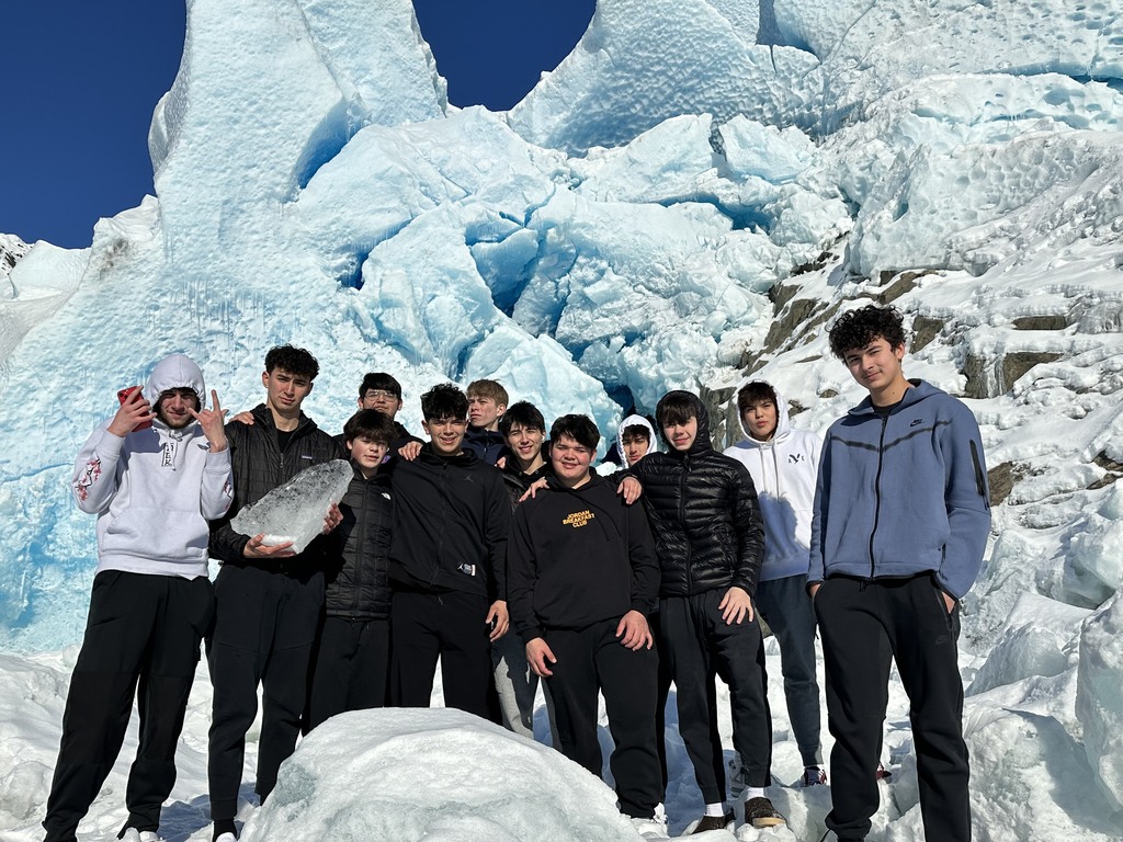 students in front of glacier
