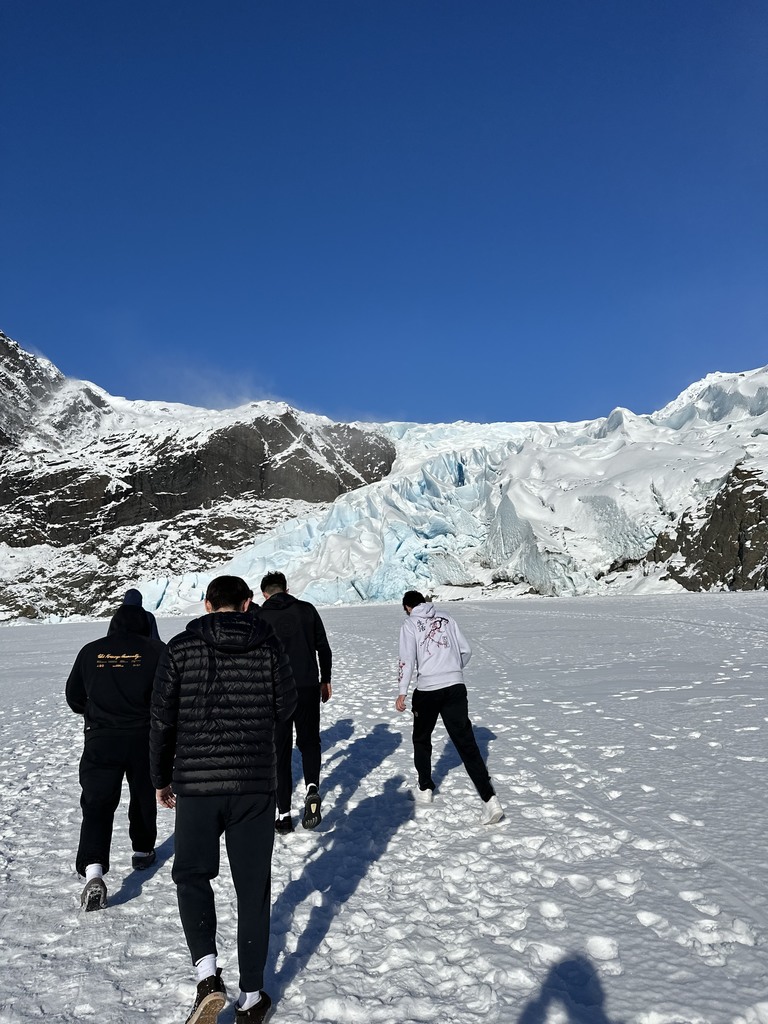 students in front of glacier