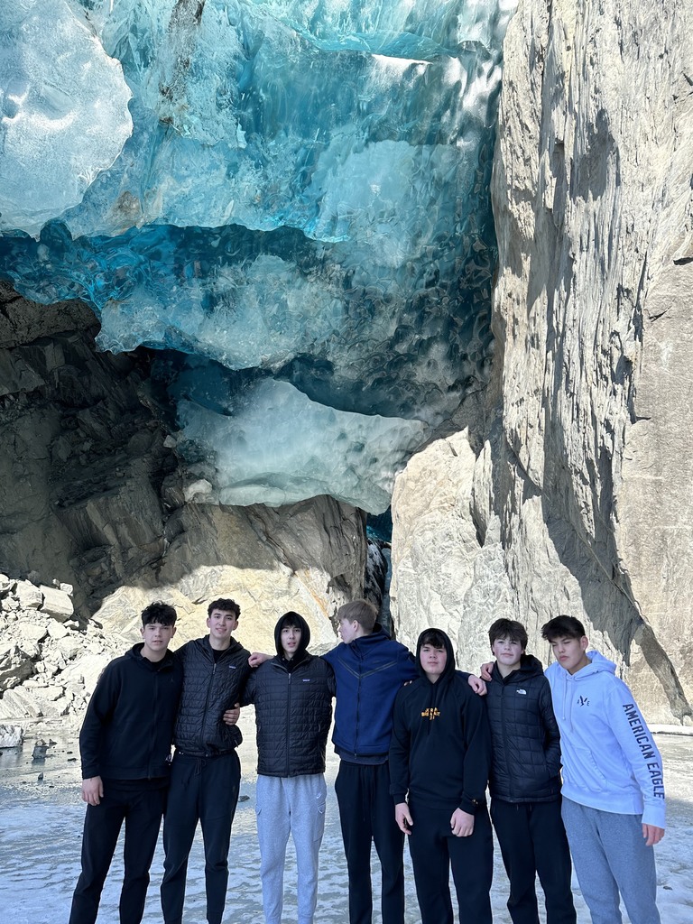 students in front of glacier